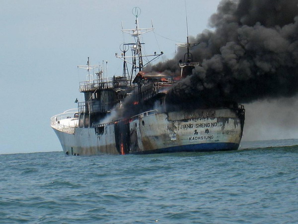 The rear of a Taiwanese fishing boat is seen engulfed in flames when it was passing through the Malacca Straits to reach Singapore, July 15, 2010. The eight fishermen on board, including two Chinese and six Filipinos, have been sent to the hospital. Their injuries were not life threatening. The preliminary cause of the fire seems to be an engine breakdown.[Xinhua]
