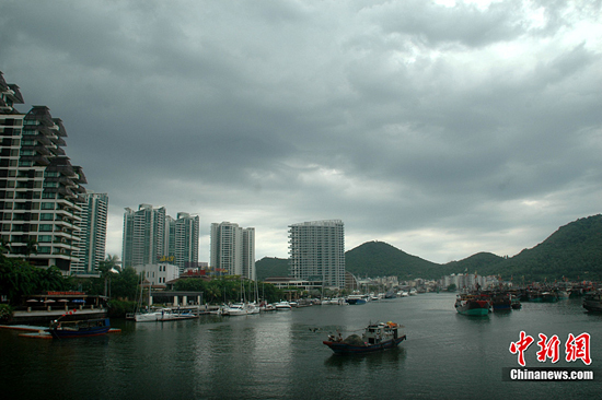  Thick clouds shroud the sky in Sanya, south China's Hainan Province, on July 15, 2010. 