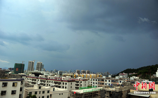 Thick clouds shroud the sky in Sanya, south China's Hainan Province, on July 15, 2010. 