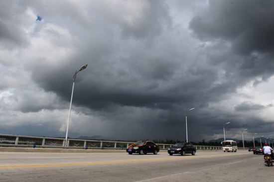 Thick clouds shroud the sky in Qionghai, south China's Hainan Province on July 15, 2010.