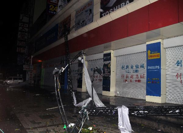 Billboards are blowed off by Typhoon Conson in Sanya City, south China's island province of Hainan, July 16, 2010. Typhoon Conson landed at Yalong Bay of Sanya City late Friday, causing casualties. [Jiang Tieying/Xinhua]