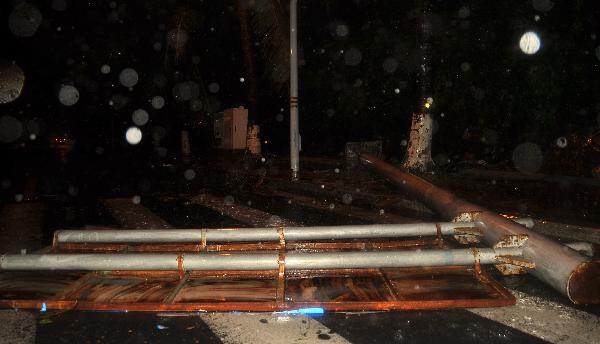 Billboards are blowed off by Typhoon Conson in Sanya City, south China's island province of Hainan, July 16, 2010. Typhoon Conson landed at Yalong Bay of Sanya City late Friday, causing casualties.[Jiang Tieying/Xinhua]