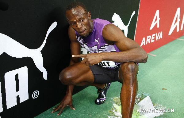 Usain Bolt of Jamaica poses after winning the men's 100m event of the Paris IAAF Diamond League meeting at the Stade de France in Saint-Denis, near Paris, France, July 16, 2010. Bolt claimed the title with a time of 9.84 seconds.[Zhang Yuwei/Xinhua]