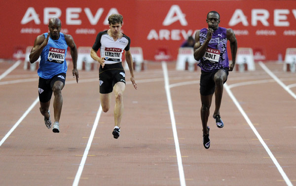 (L to R) Asafa Powell of Jamaica, Christophe Lemaitre of France and Usain Bolt of Jamaica compete in the men's 100 meters at the IAAF Diamond League athletics meeting at the Stade de France Stadium in Saint-Denis, near Paris July 16, 2010. [Xinhua]