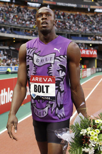 Usain Bolt of Jamaica reacts after he won the men&apos;s 100 meters at the IAAF Diamond League athletics meeting at the Stade de France Stadium in Saint-Denis, near Paris July 16, 2010. [Xinhua]