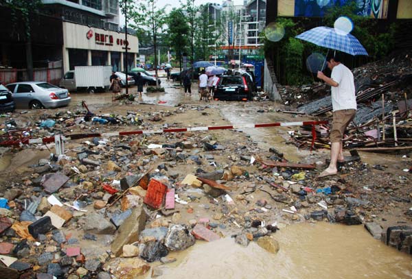 Streets are in shambles as floods lashed the Wanyuan city of Sichuan province, July 17, 2010. [Xinhua]