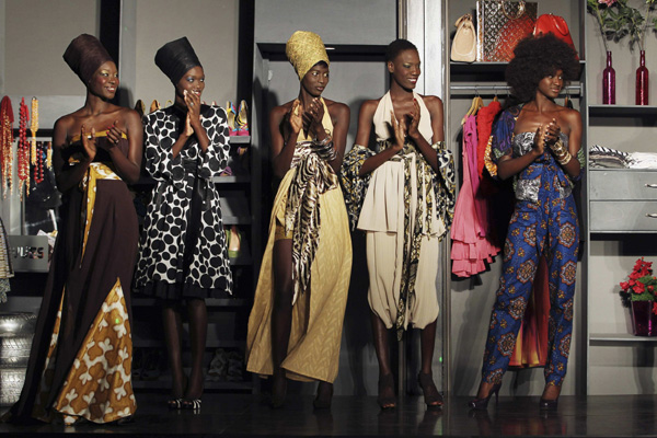  Models wearing creations by Martinique designer Paul Herve applaud during Dakar Fashion Week, July 16, 2010. Picture taken July 16, 2010. [Xinhua]