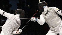 Italy's Andrea Baldini (L) and Valerio Aspromonte of Italy compete in the men's fencing individual foil final at the European Fencing Championship in Leipzig, July 18, 2010.