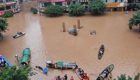 Torrential flood sweeps SW China