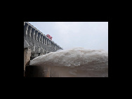 Floodwater rushes through the sluice gates of the Three Gorges Dam in Yichang, central China's Hubei province on July 19, 2010. [Xinhua]
