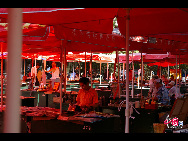 Summer Visits the Market. Photographer: Jose Gordo. Location: Baoguo Si. [China.org.cn] 