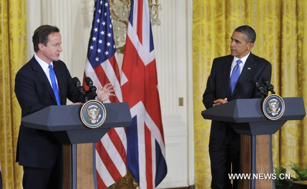 U.S. President Barack Obama (R) and visiting British Prime Minister David Cameron attend a joint press conference after their meeting at the East Room of the White House in Washington D.C., capital of the United States, July 20, 2010. [Zhang Jun/Xinhua]