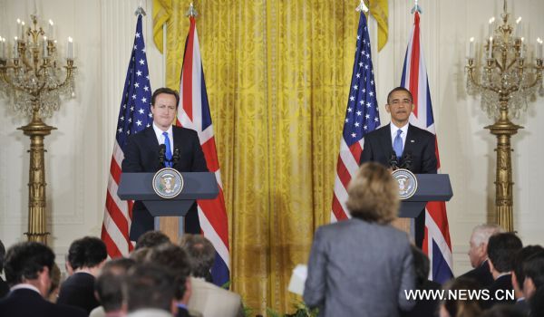 U.S. President Barack Obama (R) and visiting British Prime Minister David Cameron attend a joint press conference after their meeting at the East Room of the White House in Washington D.C., capital of the United States, July 20, 2010.[Zhang Jun/Xinhua]