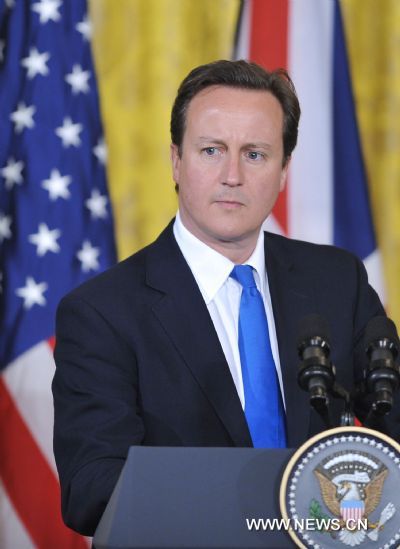 Visiting British Prime Minister David Cameron attends a joint press conference after his meeting with U.S. President Obama (not pictured) at the East Room of the White House in Washington D.C., capital of the United States, July 20, 2010. [Zhang Jun/Xinhua]