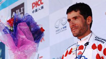 Polka dot jersey of Best Climber, Iran's Mizbani Iranagh Ghader of Team Tabriz Petrochemic celebrates on the podium after the 4th stage of the Tour of Qinhai Lake cycling race in northwest China's Qinghai Province, July 20, 2010.