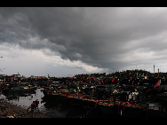 Boats anchor in a port in Qionghai City, south China's Hainan Province, July 21, 2010.  [Xinhua]