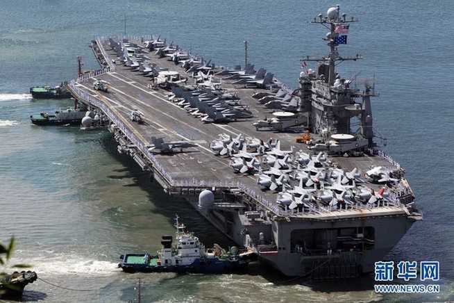 The U.S. nuclear-powered aircraft carrier USS George Washington moves to come alongside the pier at a port in Busan, about 420 km (262 miles) southeast of Seoul, July 21, 2010. The aircraft carrier will participate in a massive combined air and naval exercise to be held by South Korea and the U.S. in the East Sea from July 25 to 28 to show deterrence plans against North Korea. [Xinhua]