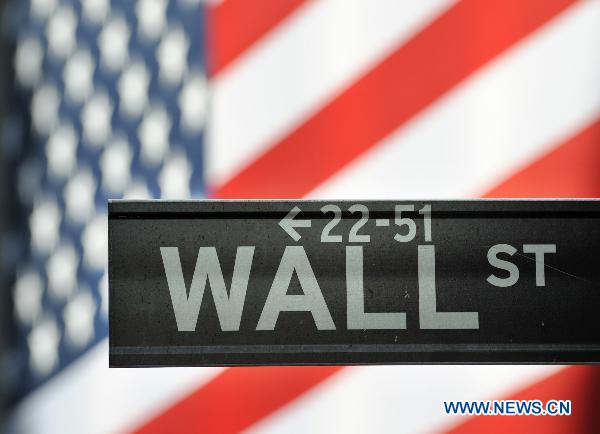 The Wall Street nameplate is pictured in New York, the United States, July 21, 2010. U.S. President Barack Obama on Wednesday signed into law the financial regulation reform bill, the most ambitious rewrite of the country's financial-regulatory system since the Great Depression. [Shen Hong/Xinhua]