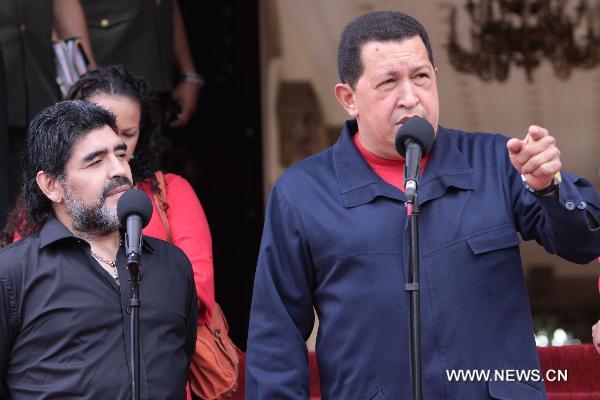 Venezuelan President Hugo Chavez (R) meets with Argentine soccer coach and former player Diego Maradona at the Miraflores Palace in Caracas, capital of Venezuela, July 22, 2010. 