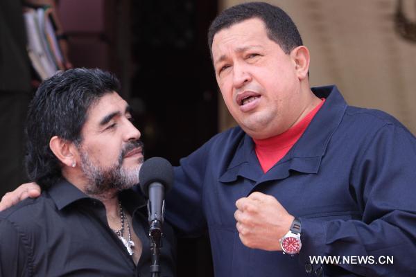 Venezuelan President Hugo Chavez (R) meets with Argentine soccer coach and former player Diego Maradona at the Miraflores Palace in Caracas, capital of Venezuela, July 22, 2010. 