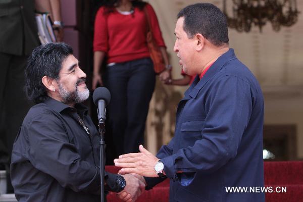 Venezuelan President Hugo Chavez (R) meets with Argentine soccer coach and former player Diego Maradona at the Miraflores Palace in Caracas, capital of Venezuela, July 22, 2010. 