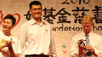 Chinese basketball star and Houston Rockets center Yao Ming (C), Chinese basketball player Liu Wei (L) and NBA player Chase Budinger attend the charity gala for Yao Foundation Charity Tour in Beijing, capital of China, July 23, 2010.