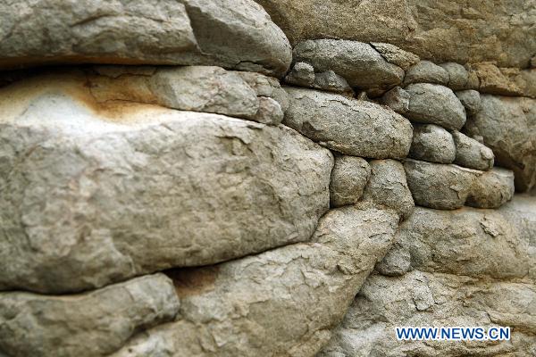 Photo taken on July 24, 2010 shows spectacular columnar basalt located in Penghu County of southeast China's Taiwan. The natural wonder attracted tourists from all around the world. 