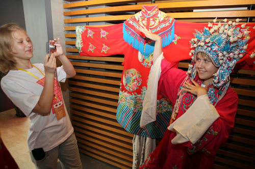 Two Russian students pose at the office of Hanban. The first 'Chinese Bridge' summer camp for Russian high school students is held in Beijing on July 24-August 6, attracting 172 students and teachers from all over Russia.