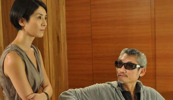 Actress Charlie Young works with director Tsui Hark for a test film for Tsui's 3-D feature 'New Dragon Gate Inn'.