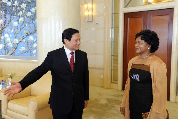 Liu Qi(L), a member of the Political Bureau of the Central Committee of the Communist Party of China (CPC) and secretary of the CPC Beijing Municipal Committee, meets with chairperson of South Africa's African National Congress (ANC) Baleka Mbete in Beijing, capital of China, July 28, 2010. [Li Tao/Xinhua]