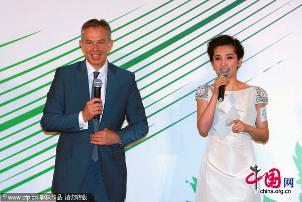Tony Blair and Li Bingbing attend the first anniversary of the Million Forest campaign in Shanghai on Tuesday, July 27, 2010, to celebrate reaching the initial target of planting one million sea buckthorn trees in northwest China in just one year.