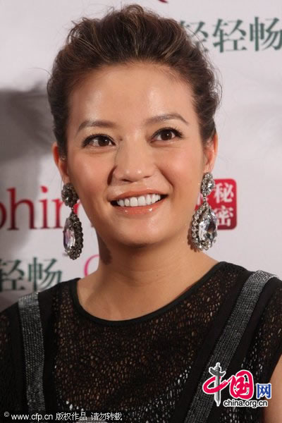 Actress Zhao Wei promotes a beverage brand in Beijing on Tuesday, July 27, 2010.