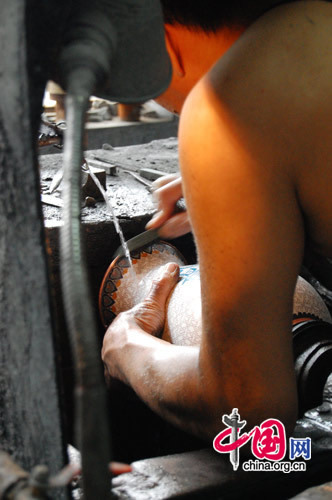 After the last baking session, the pieces are sent to the polisher, who uses sandstone and an emery stone to smooth and shine the art.