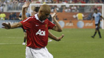 Manchester United's Wes Brown (L) collides with Major League Soccer All-Star David Ferreira during their exhibition soccer match in Houston July 28, 2010.