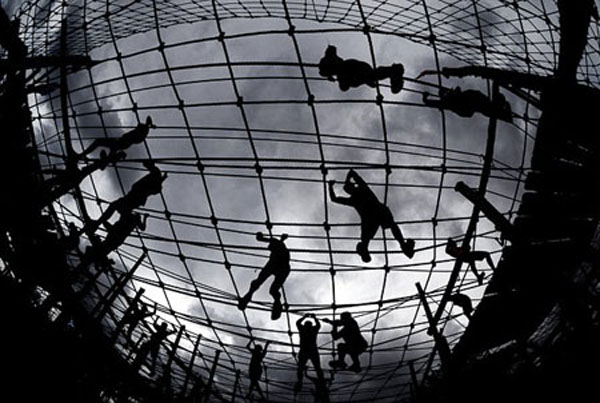 Competitors navigate a rope course during the Tough Guy Challenge on July 25, 2010.