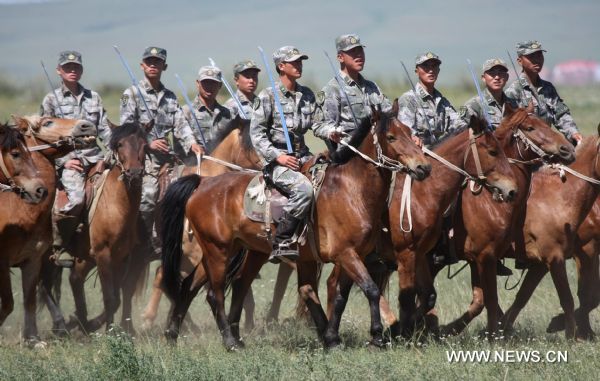 Cavalry men have a military training on Xilingol grassland, north China's Inner Mongolia Autonomous Region, July 31, 2010, to greet the upcoming 83rd anniversary of the founding of the People's Liberation Army (PLA) that falls on August 1.