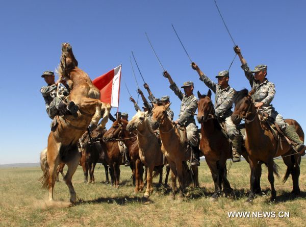 Cavalry men have a military training on Xilingol grassland, north China's Inner Mongolia Autonomous Region, July 31, 2010, to greet the upcoming 83rd anniversary of the founding of the People's Liberation Army (PLA) that falls on August 1.