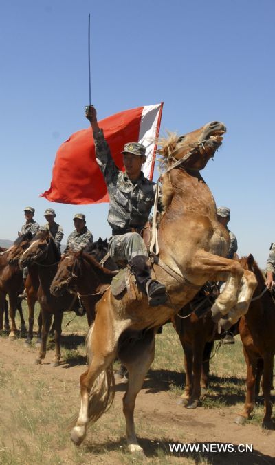 Cavalry men have a military training on Xilingol grassland, north China's Inner Mongolia Autonomous Region, July 31, 2010, to greet the upcoming 83rd anniversary of the founding of the People's Liberation Army (PLA) that falls on August 1.