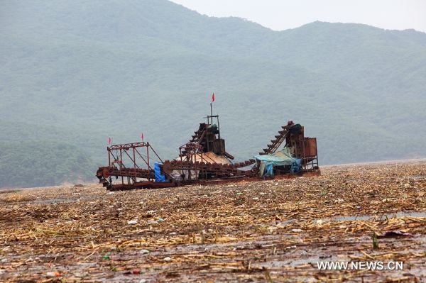 A heavy vessel is seen on the Songhua Lake, northeast China's Jilin Province, July 31, 2010.