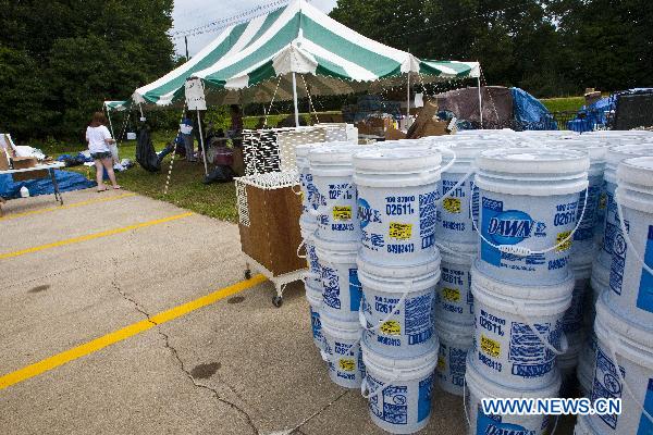 Large tubs of liquid detergent are gathered at a community donation collection site organized by Enbridge to aid in the cleanup of oil-stricken animals, in Marshall, Michigan, the United States, July 31, 2010.