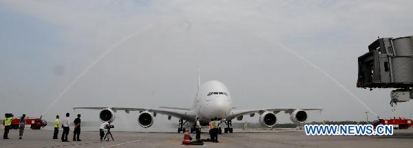 Emirates Airlines&apos; A380 passenger plane of the United Arab Emirates (UAE) arrives at the Capital International Airport in Beijing, capital of China, on Aug. 1, 2010. Emirates Airlines launched its first A380 service in China, flight EK306/307 between Dubai and Beijing on Sunday. [Xinhua]