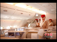 The photo shows air hostesses of Emirates' Airbus A380 which arrives at the Capital International Airport in Beijing August 1, 2010. [Chinanews.com] 