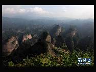 The World Heritage Committee decided to include China Danxia Landform in the World Heritage List at its 34th meeting being held in Brasilia, capital of Brazil, on Aug.1, 2010. The six Danxia landform areas are: Mountain Langshan (Hunan Province), Mountain Danxiashan (Guangdong Province), Taining (Fujian Province), Mountain Longhushan and Guifeng (Jiangxi Province), Chishui (Guizhou Province), Mountain Jianglangshan (Zhejiang Province). [Xinhua]