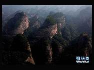 The World Heritage Committee decided to include China Danxia Landform in the World Heritage List at its 34th meeting being held in Brasilia, capital of Brazil, on Aug.1, 2010. The six Danxia landform areas are: Mountain Langshan (Hunan Province), Mountain Danxiashan (Guangdong Province), Taining (Fujian Province), Mountain Longhushan and Guifeng (Jiangxi Province), Chishui (Guizhou Province), Mountain Jianglangshan (Zhejiang Province). [Xinhua]