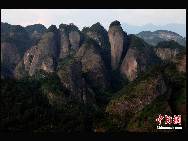 The World Heritage Committee decided to include China Danxia Landform in the World Heritage List at its 34th meeting being held in Brasilia, capital of Brazil, on Aug.1, 2010. The six Danxia landform areas are: Mountain Langshan (Hunan Province), Mountain Danxiashan (Guangdong Province), Taining (Fujian Province), Mountain Longhushan and Guifeng (Jiangxi Province), Chishui (Guizhou Province), Mountain Jianglangshan (Zhejiang Province). [Chinanews.com]