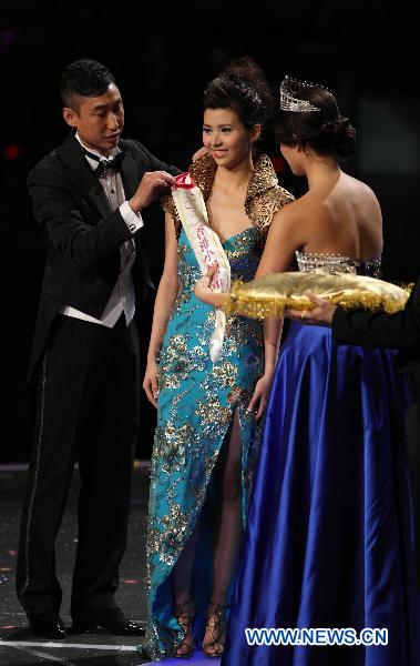 Sammi Cheung, contestant of Miss Hong Kong 2010 Pageant, poses after winning the first runner-up of the annual beauty contest in Hong Kong, south China, Aug. 2, 2010.