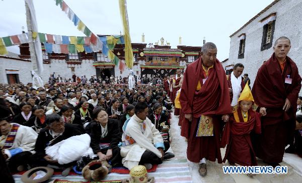 The enthronement of the sixth Living Buddha Dezhub is held at Zagor Monastery in Shannan Prefecture of southwest China&apos;s Tibet Autonomous Region, Aug. 2, 2010. The young Living Buddha, whose secular name is Losang Doje, was chosen as one of the candidates after years of searching by senior monks according to religious practice and traditions. Bainqen Erdini Qoigyijabu, the 11th Panchen Lama, gave him the religious name Dezhub Jamyang Sherab Palden.[Xinhua]