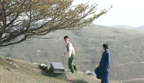 Actress Zhou Dongyu as Jing Qiu and Dou Xiao as Lao San in Zhang Yimou's new film, 'The Love of the Hawthorn Tree'