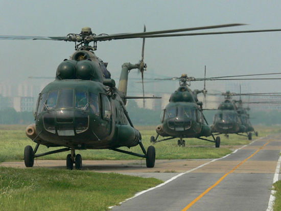 Helicopters take off during the five-day military exercise code-named 'Vanguard-2010,' across Henan and Shandong provinces, August 4, 2010.[Photo/Xinhua]