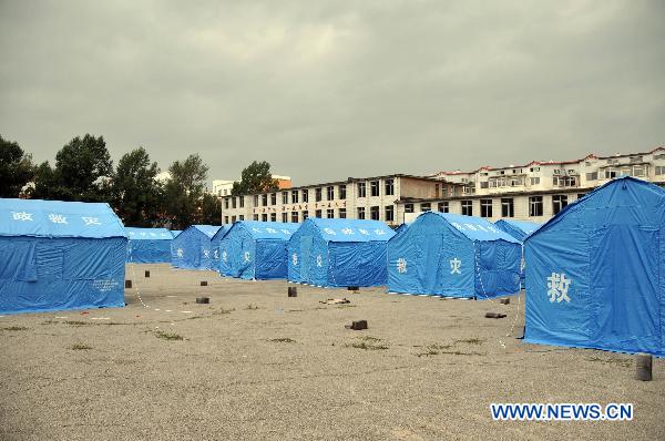Temporary tents are set up at a relocation place in Baishan County, northeast China's Jilin Province, Aug. 5, 2010. Rainfall reached 204 mm over the previous 24 hours as of 8 a.m. Thursday in central Jilin, the provincial meteorological station said. Constant rains had forced seven of the 25 medium and large reservoirs in Jilin City, including Fengman, Baishan and Xingxingshao, to discharge water, and their levels were falling, according to Jilin municipal government. [Xinhua]